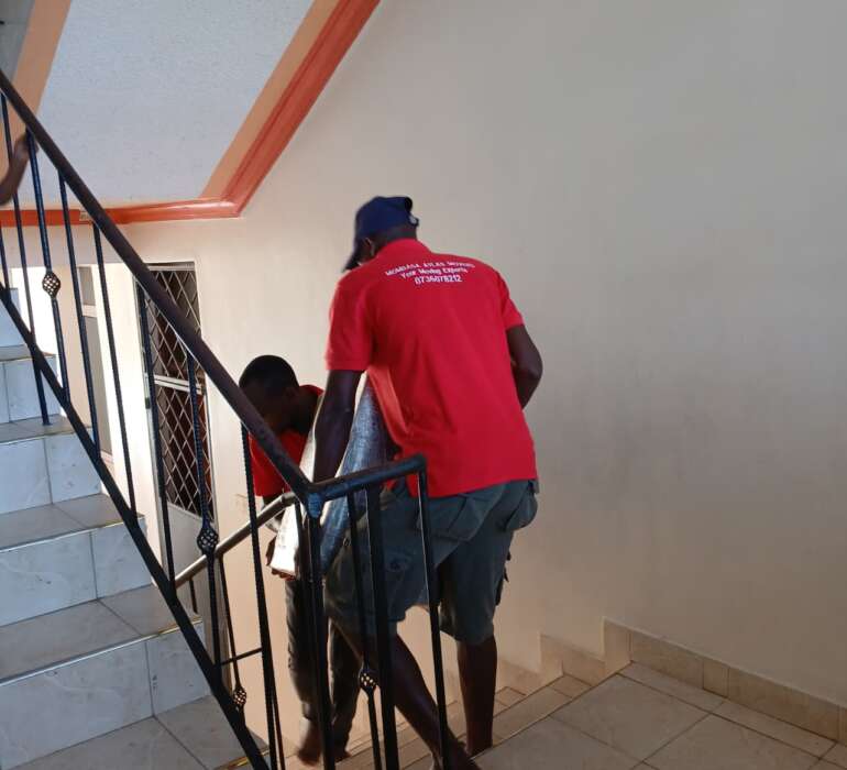 Atlas Movers Team Moving Cooker Downstairs
