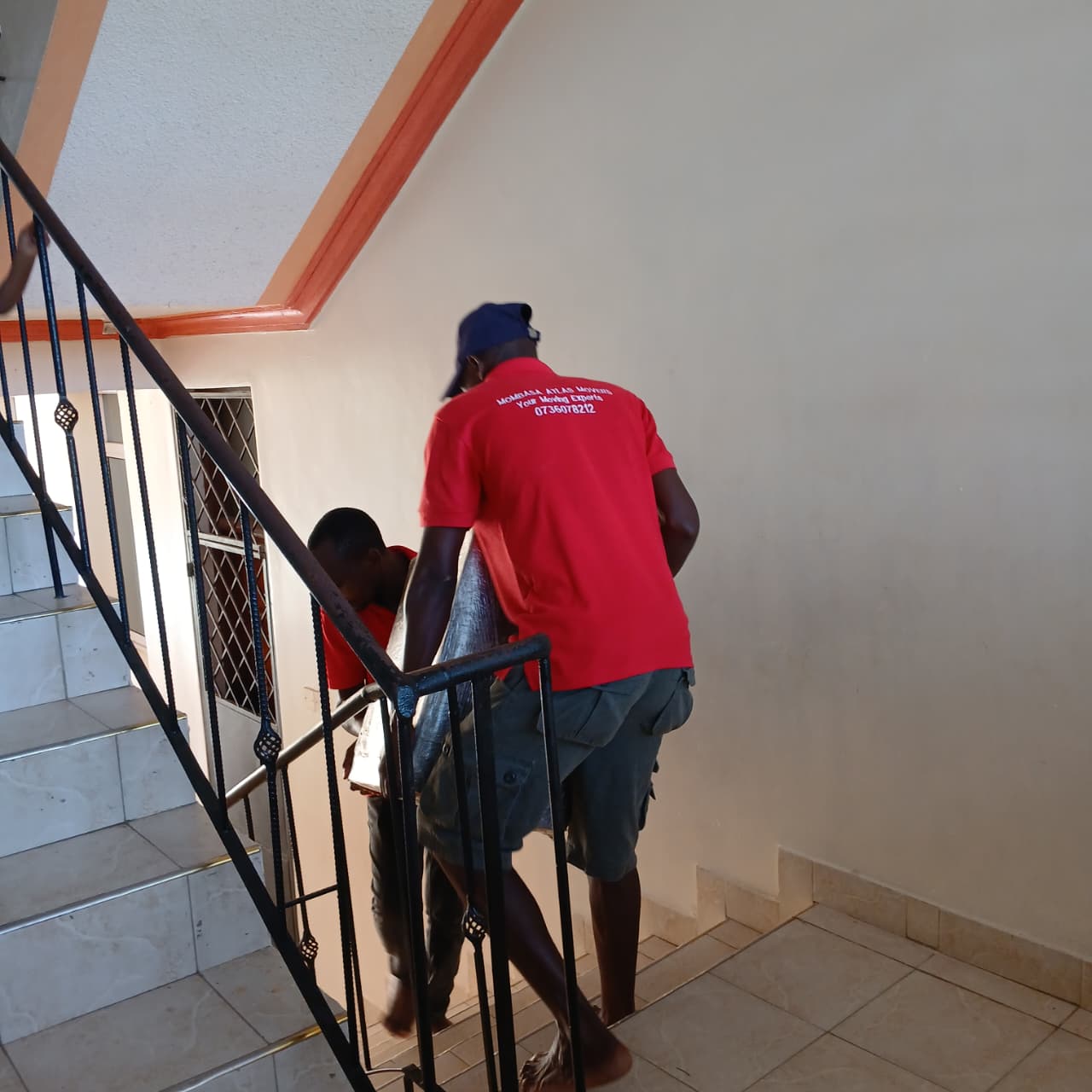 Atlas Movers Team Moving Cooker Downstairs